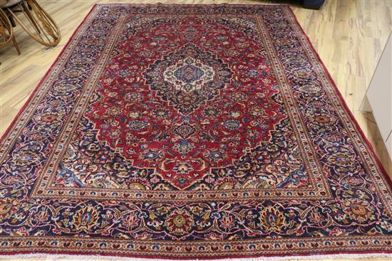 A small Persian red ground carpet, 330 x 240cm